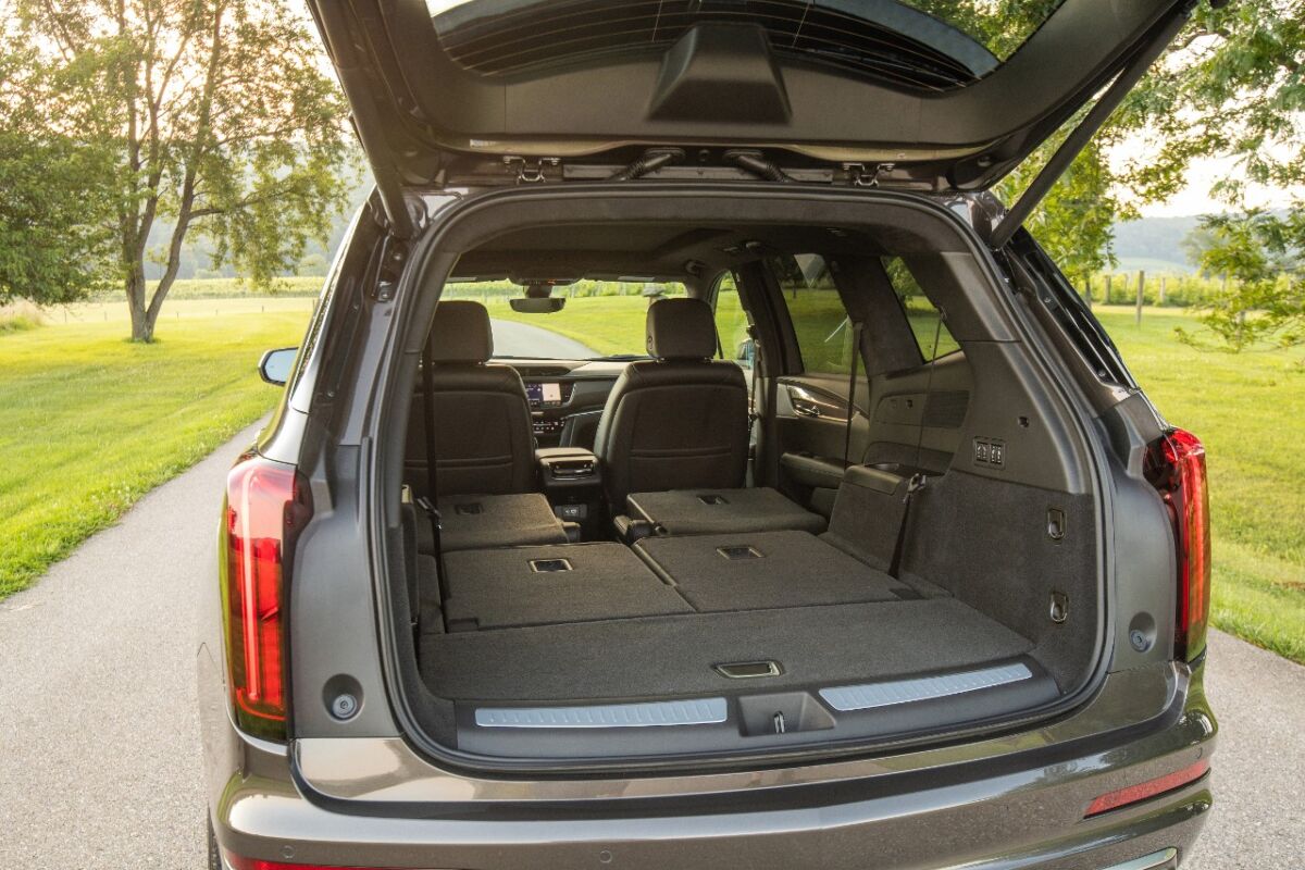 The cargo area has a usable 12.6 cubic feet of storage behind the third row, with some basement storage. From the back end, the third-row seats power fold, up or down, and there is a power release for the second-row seats, but without power to raise. Fold the third row for about 44 inches of length or fold both rows for 6.5 feet.