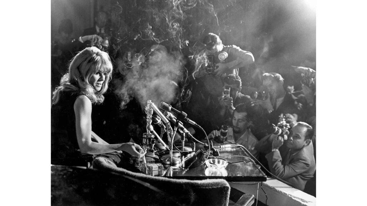 April 19, 1966: Julie Christie meets a throng of photographers and reporters at the Beverly Hills Hotel the morning after winning her Best Actress Oscar for "Darling."