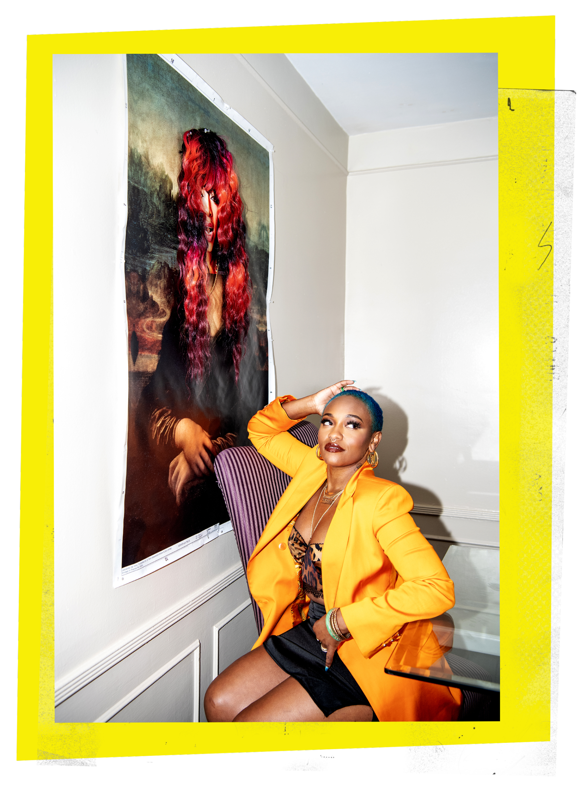 Portrait of celebrity hairstylist Shelby Swain posing in front of the artwork “Mona Trina”
