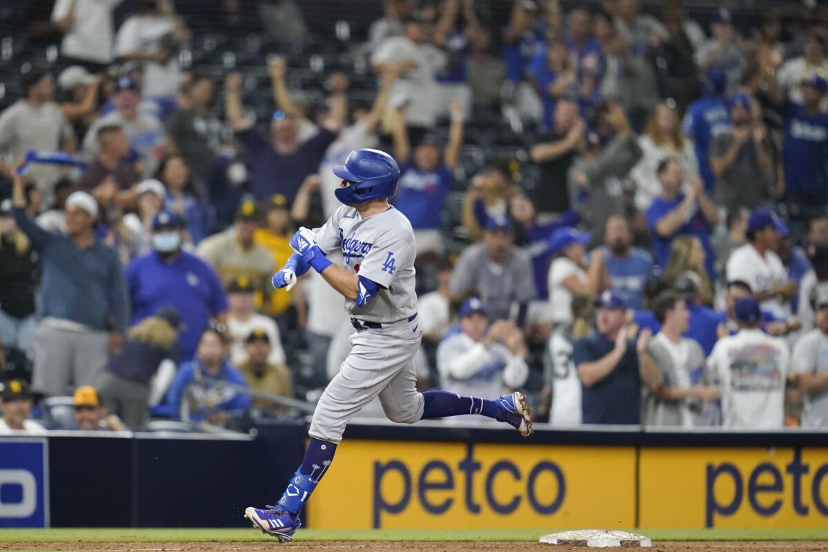 The Dodgers' AJ Pollock rounds the bases after hitting a two-run homer in the 16th inning against the Padres