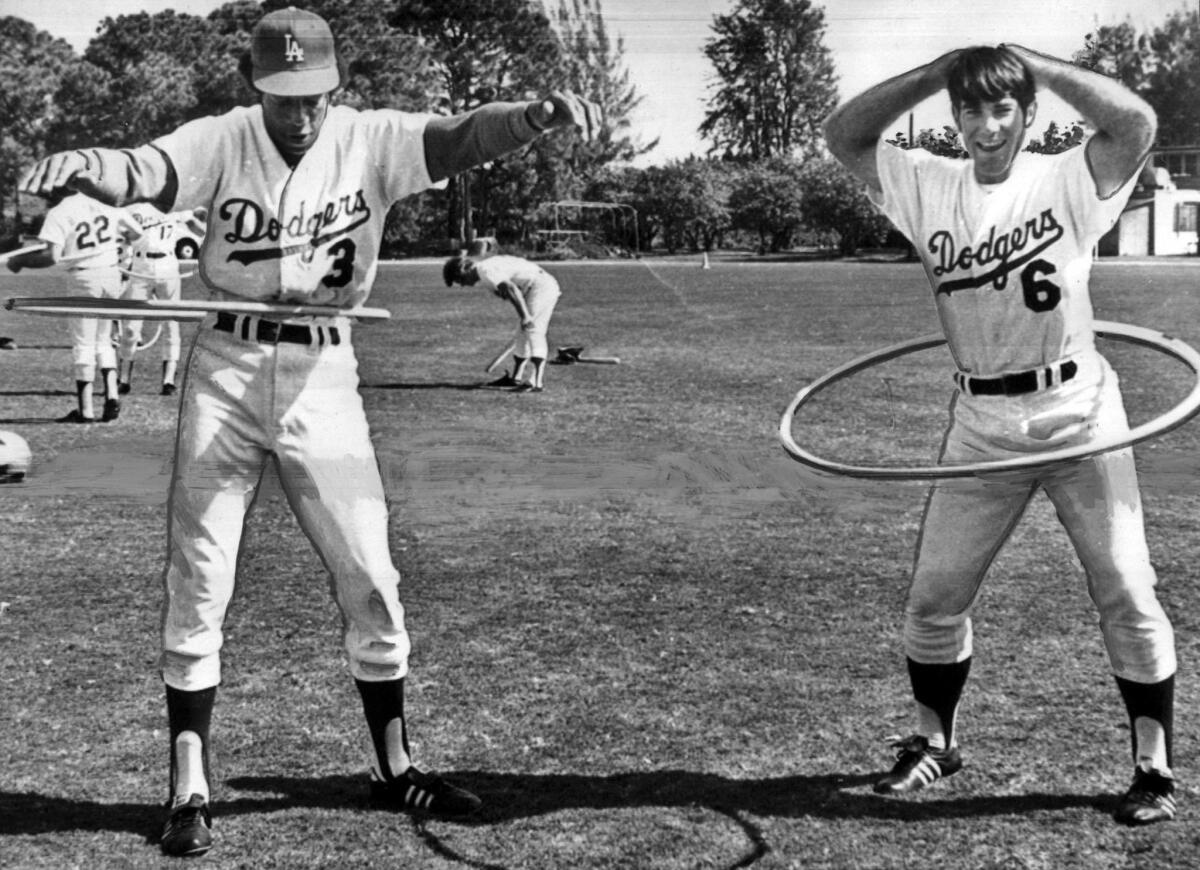 March 7, 1973: Los Angeles Dodgers Willie Davis, left, and Steve Garvey use hula hoops during an exercise period.