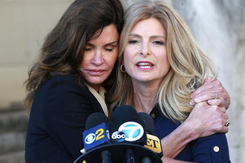 Janice Dickinson, left, and her attorney, Lisa Bloom, speak during a news conference at a motions hearing in her lawsuit against comedian Bill Cosby in Los Angeles on Tuesday.