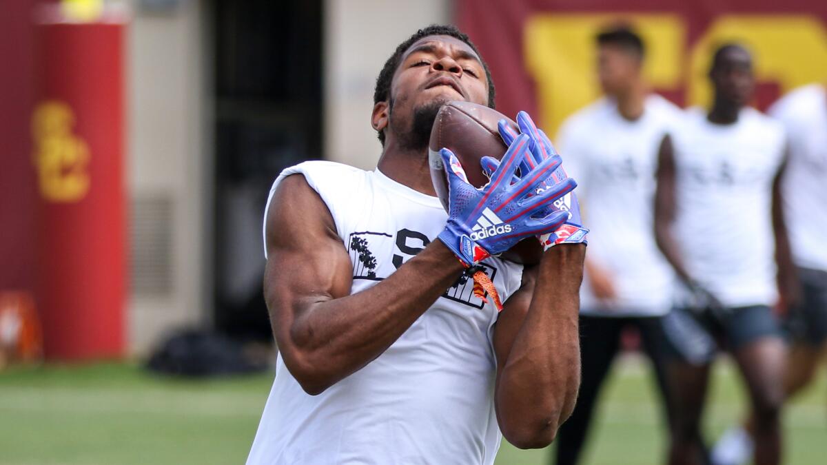Inglewood receiver Montana Lemonious-Craig makes an over-the-shoulder catch during a summer camp at USC on June 19.