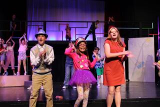 Amani Solorio, center, performs with other students in the musical "Junie B. Jones."