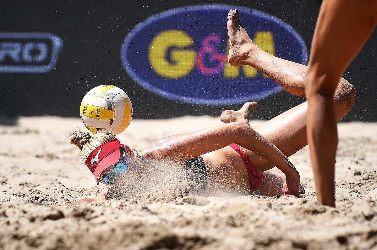April Ross dives for the ball during the Manhattan Beach Open women's final on Sunday.