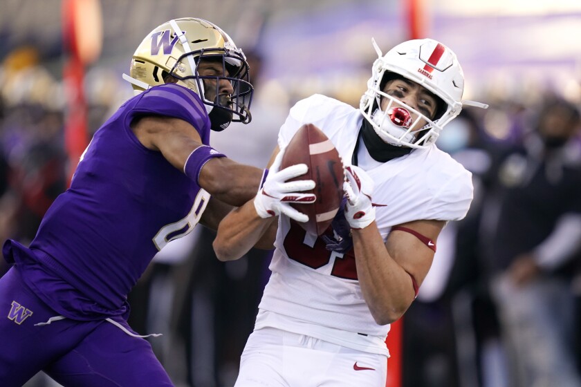 Stanford wide receiver Brycen Tremayne, right, catches a 33-yard pass.