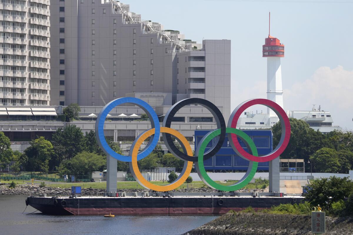 The Olympic rings float on a barge in Tokyo