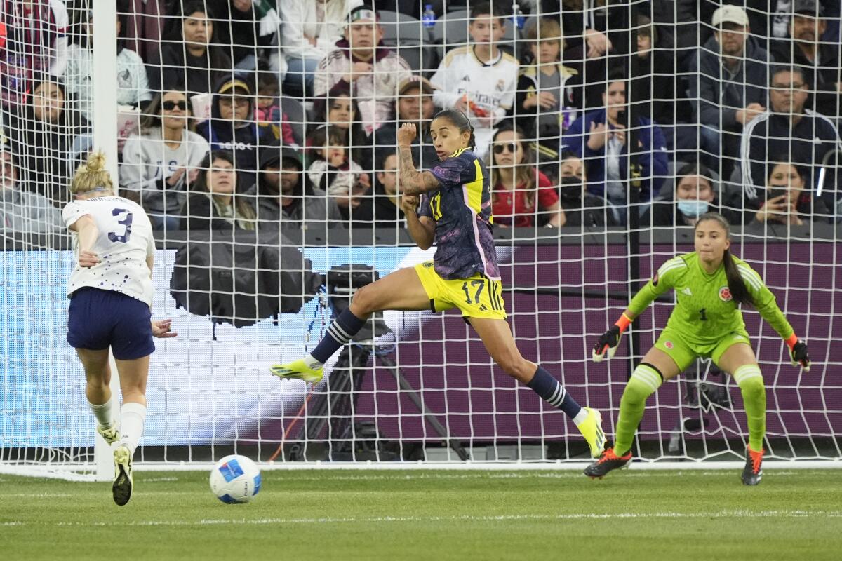 United States defender Jenna Nighswonger (3) shoots and scores past Colombia defender Carolina Arias (17).