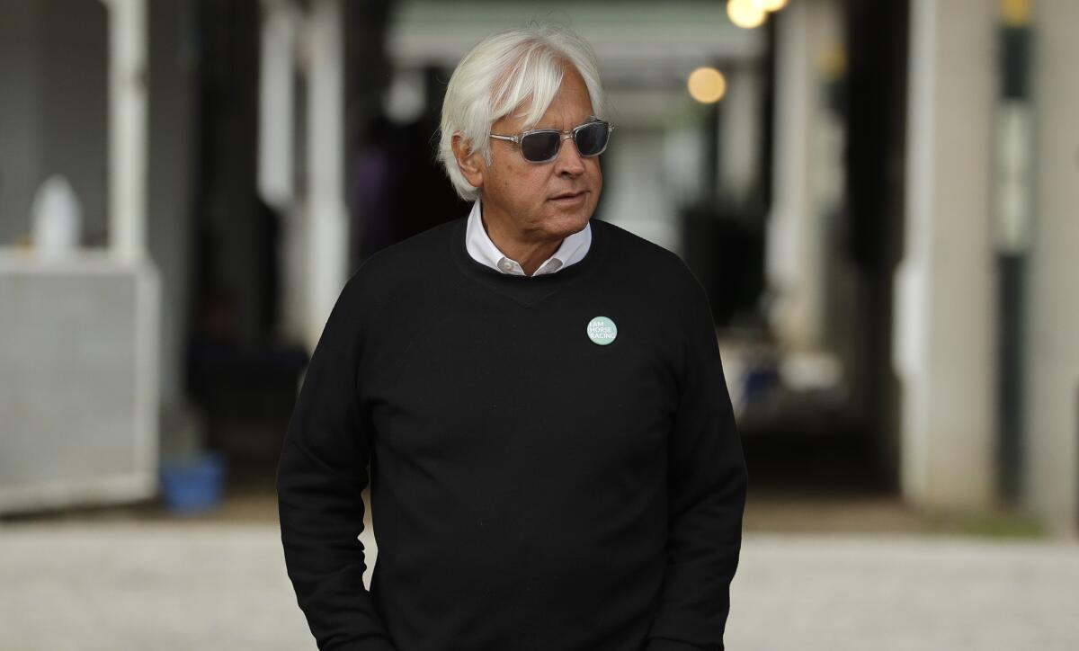 Trainer Bob Baffert looks out from his barn at Churchill Downs.