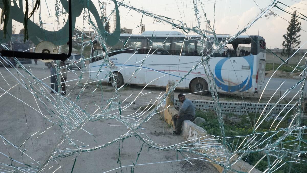 The view from inside a bus outside Aleppo, Syria, on April 16, 2017, one day after a car bomb went off next to a convoy of buses filled with evacuees.