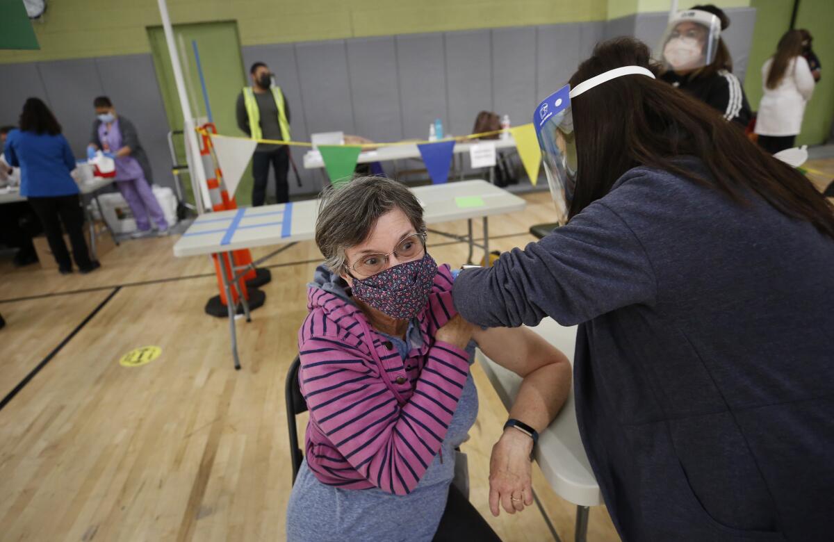 A Los Angeles substitute teacher receives a coronavirus vaccine.