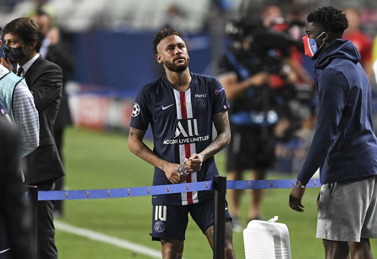 PSG's Neymar stands on the pitch disappointed after losing the Champions League final soccer match between Paris Saint-Germain and Bayern Munich at the Luz stadium in Lisbon, Portugal, Sunday, Aug. 23, 2020. (David Ramos/Pool via AP)