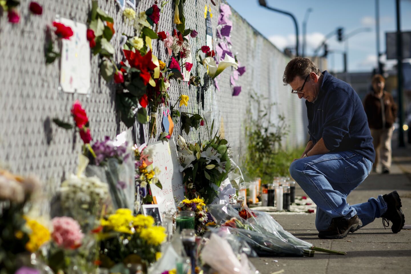 Flowers, candles and notes, memorializing those killed and injured in the "Ghostship" warehouse fire that burned and killed at least 36 people in the Oakland neighborhood of Fruitvale.