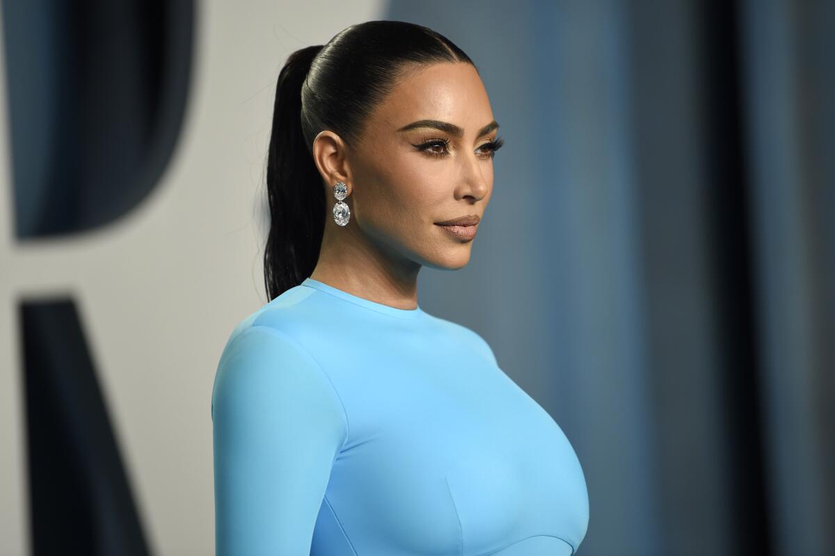 A woman in a powder blue dress