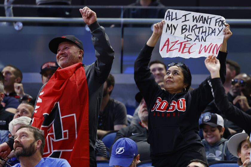 Orlando, FL - March 16: San Diego State fans celebrate during a win against the College of Charleston in the first round of the NCAA Tournament in Orlando on Thursday, March 16, 2023.. (K.C. Alfred / The San Diego Union-Tribune)