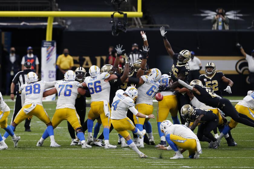 Los Angeles Chargers kicker Mike Badgley (4) attempts a field goal that was no good, forcing overtime, in the second half of an NFL football game in New Orleans, Monday, Oct. 12, 2020. (AP Photo/Butch Dill)