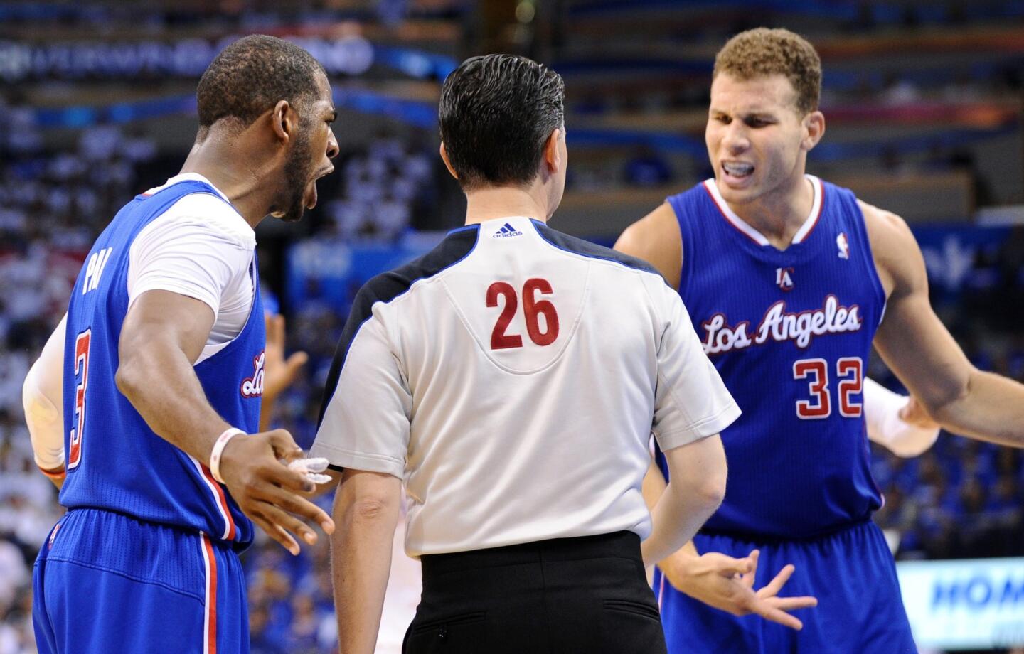 Clippers point guard Chris Paul and power forward Blake Griffin (32) give referee Pat Fraher an earful during Game 2.