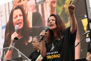 LOS ANGELES CA SEPTEMBE 13, 2023 -- SAG-AFTRA president Fran Drescher addresses striking writers and actors in a boisterous rally outside Paramount studios on Wednesday, Sept. 13, 2023. The Writers Guild of America has been on strike since early May. The SAG-AFTRA actors' union joined the writers on the picket lines in July. (Al Seib / For The Times)
