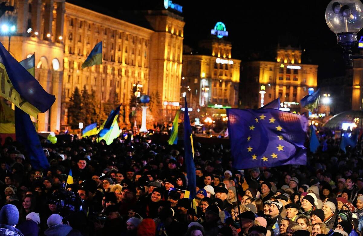 Demonstrators, some waving Ukrainian and European Union flags, gather in Kiev's Independence Square to denounce President Viktor Yanukovich's rejection of an association agreement with the EU.