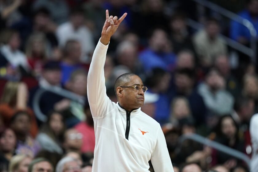 Texas interim head coach Rodney Terry directs his team in the first half of a second-round college basketball game against Penn State in the NCAA Tournament, Saturday, March 18, 2023, in Des Moines, Iowa. (AP Photo/Charlie Neibergall)