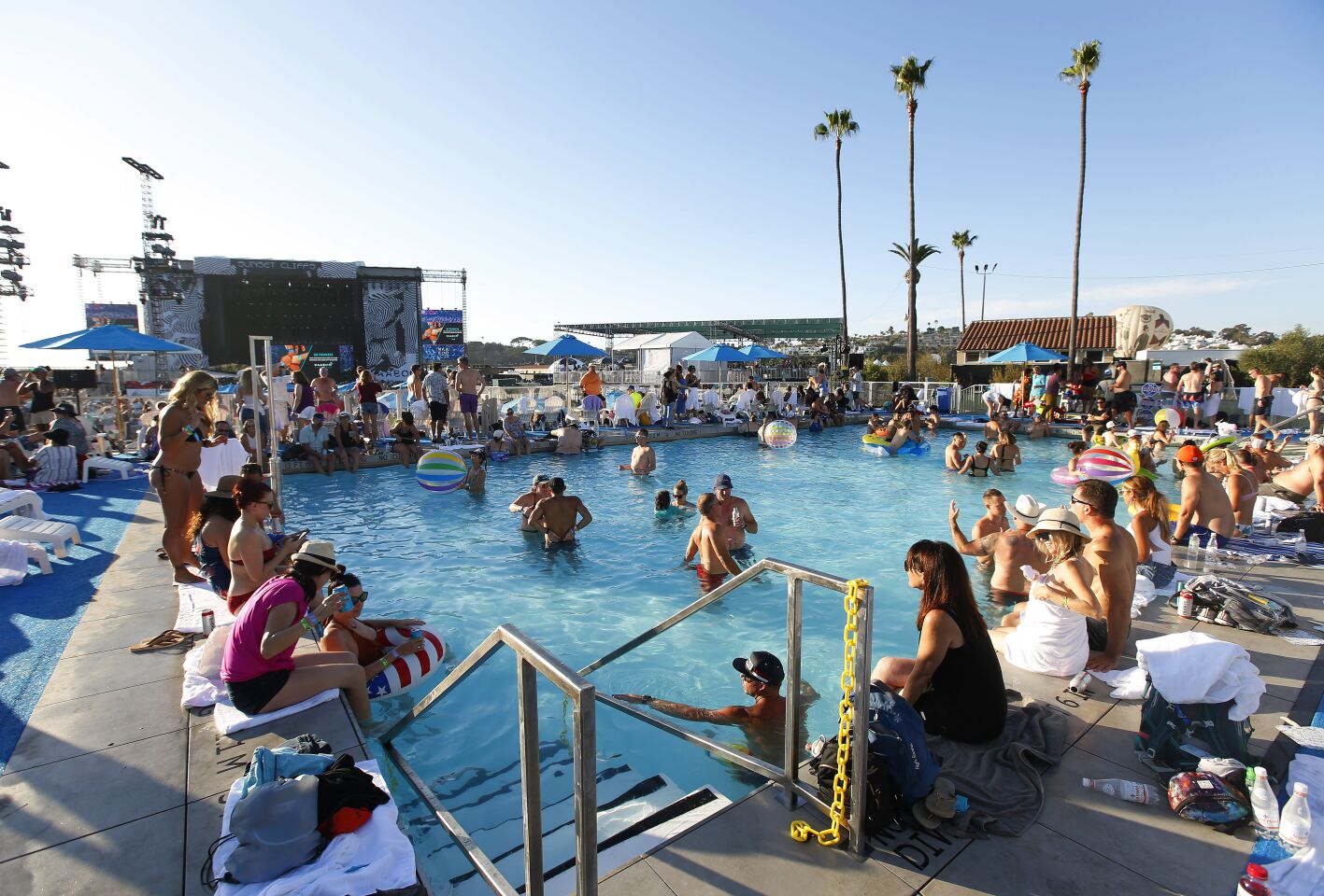 Concert goers relax at the Bask Swim Club at KAABOO Del Mar on Sept. 14, 2019.