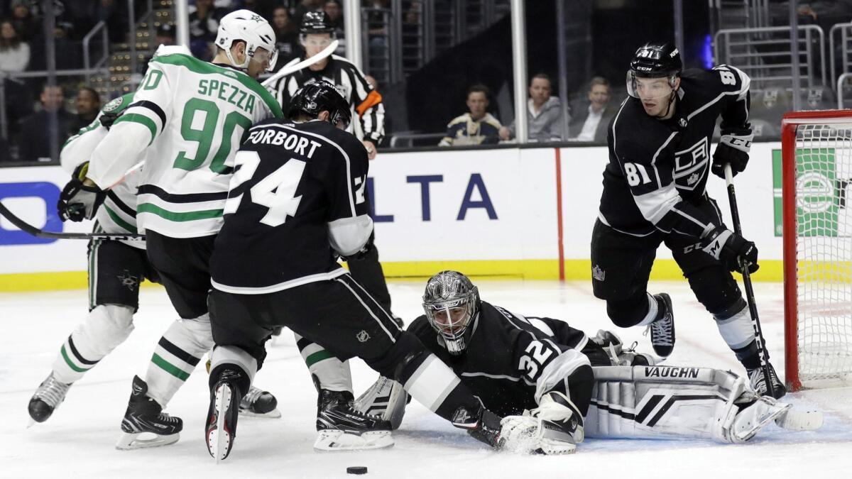 Kings goaltender Jonathan Quick stops a shot by the Dallas Stars during the third period of the Kings' 4-3 overtime loss on Feb. 28.