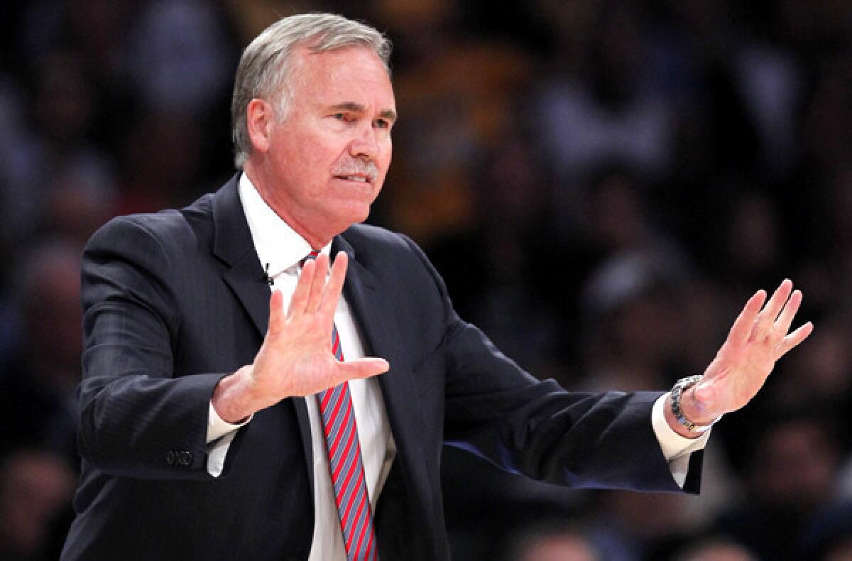 Lakers Coach Mike D'Antoni gives instructions to his players during a game against the San Antonio Spurs last month at Staples Center.
