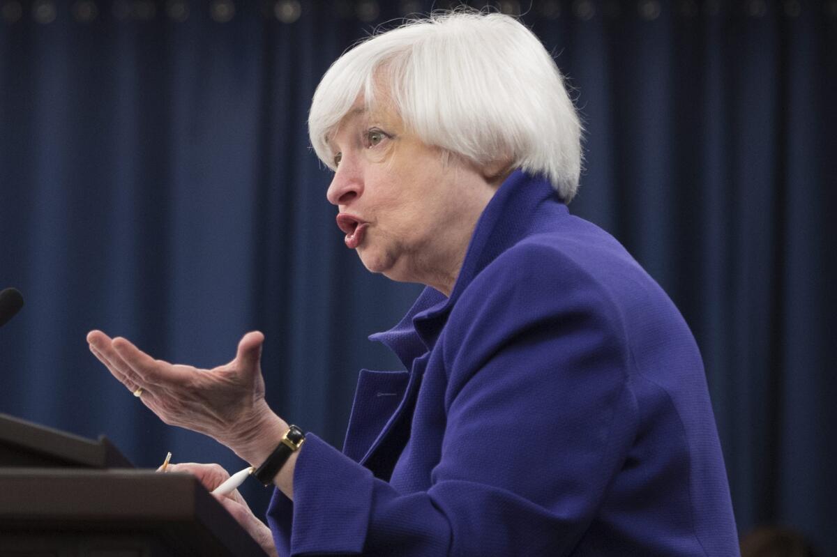 Federal Reserve Chairwoman Janet L. Yellen speaks with reporters Wednesday after the central bank announced the first increase in a key interest rate since 2006.
