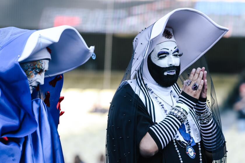 Los Angeles, CA - June 16: The Sisters of Perpetual Indulgence, a longtime charity organization made up queer nuns often in drag, receive the Community Hero Award in a pregame ceremony on pride night at the Dodger Stadium on Friday, June 16, 2023 in Los Angeles, CA. (Dania Maxwell / Los Angeles Times).