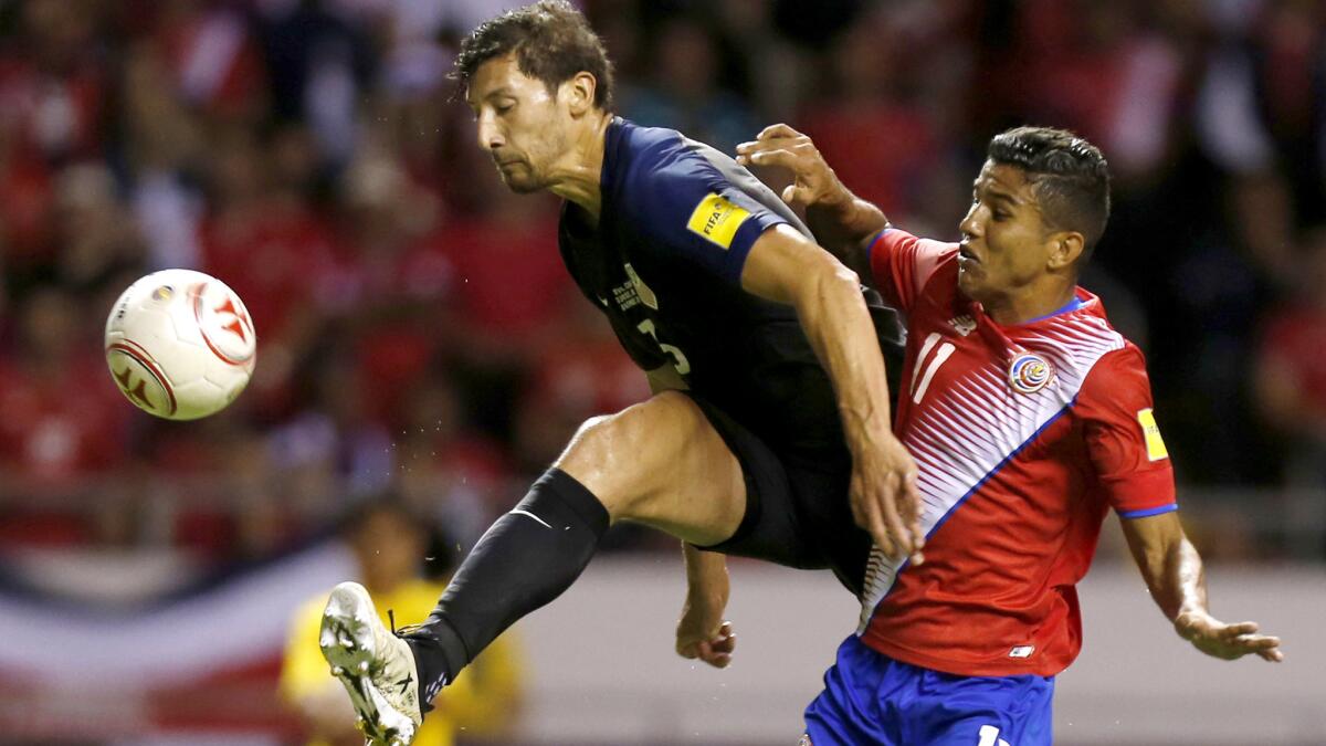 Omar Gonzalez, while playing for the U.S. national team, clears a pass to Costa Rica's Johan Venegas during a World Cup qualifying game last May.