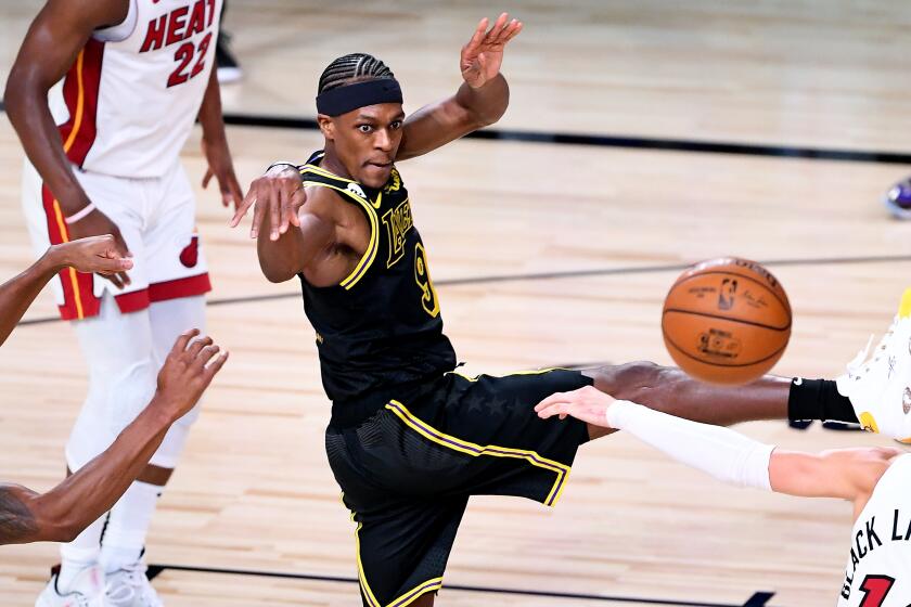 ORLANDO, FLORIDA OCTOBER 2, 2020-Lakers Rajon Rondo passes against the Heat in the 4th quarter.