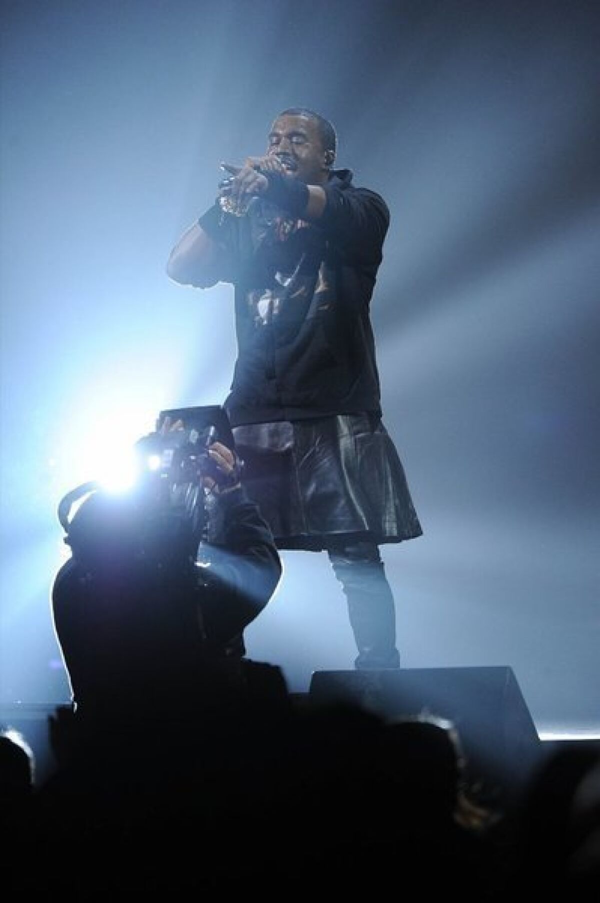 Rapper Kanye West performs at the 12-12-12 benefit for Superstorm Sandy victims Wednesday night.