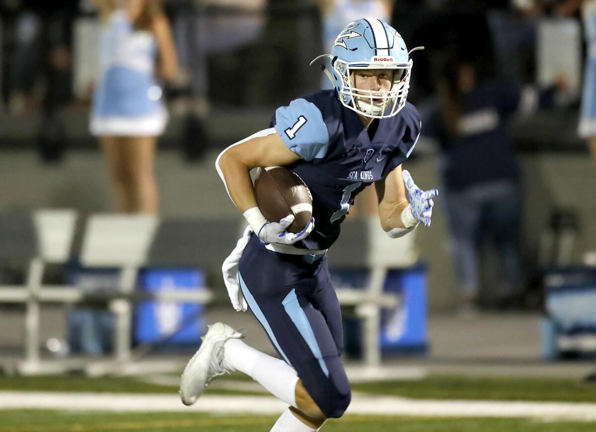 Corona del Mar receiver Max Lane runs for a touchdown after a pass from David Rasor.