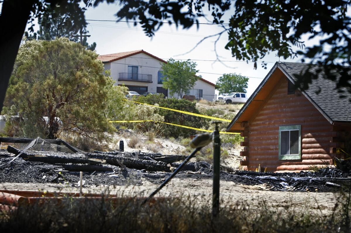 The burned ruins of a house on Ross Avenue in Boulevard, Calif., where the bodies of a mother and a boy were found by arson investigators. James Lee DiMaggio, 40, who lived there, and the deceased mother's daughter, Hannah Anderson, 16, are missing.