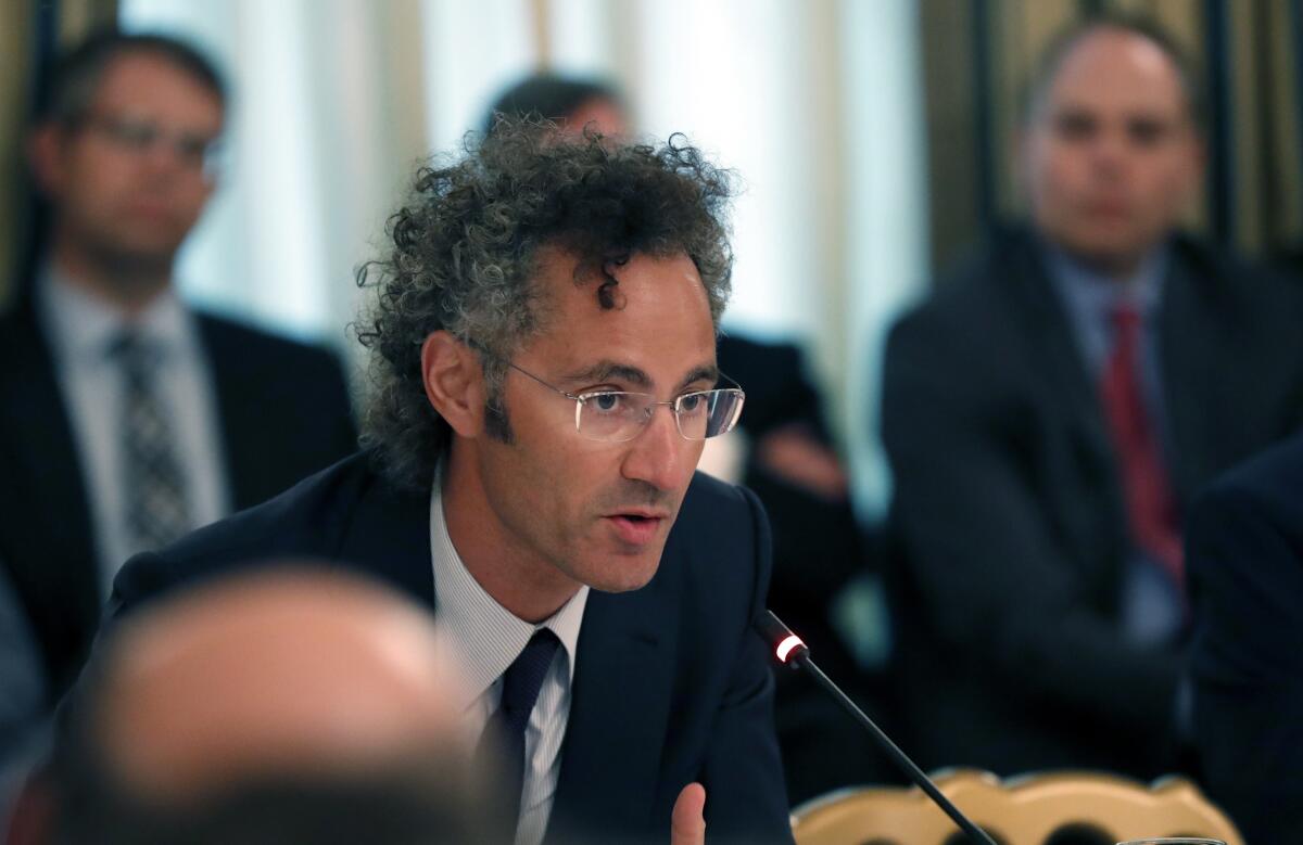 Alex Karp, chief executive of Palantir, speaks during a roundtable at the White House in June 2017. 