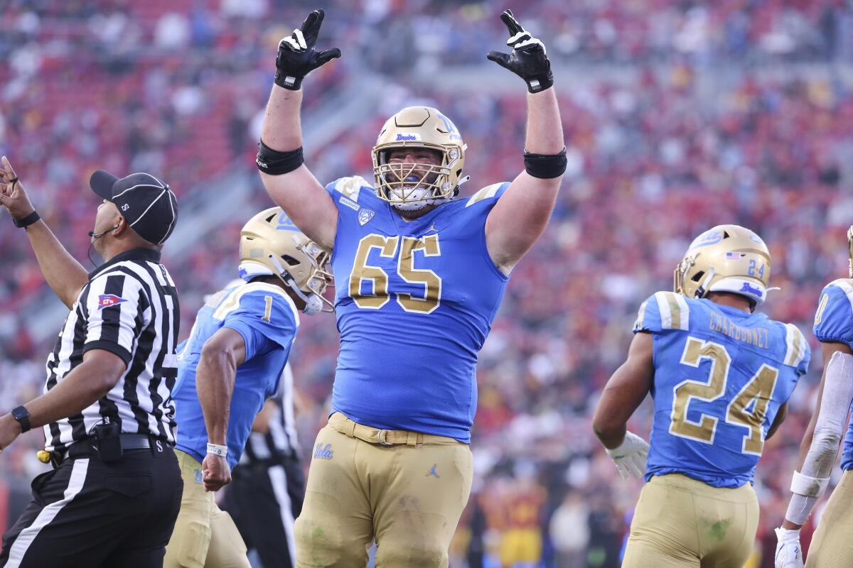 UCLA offensive lineman Paul Grattan, Jr. celebrates after quarterback Dorian Thompson-Robinson scored a touchdown.