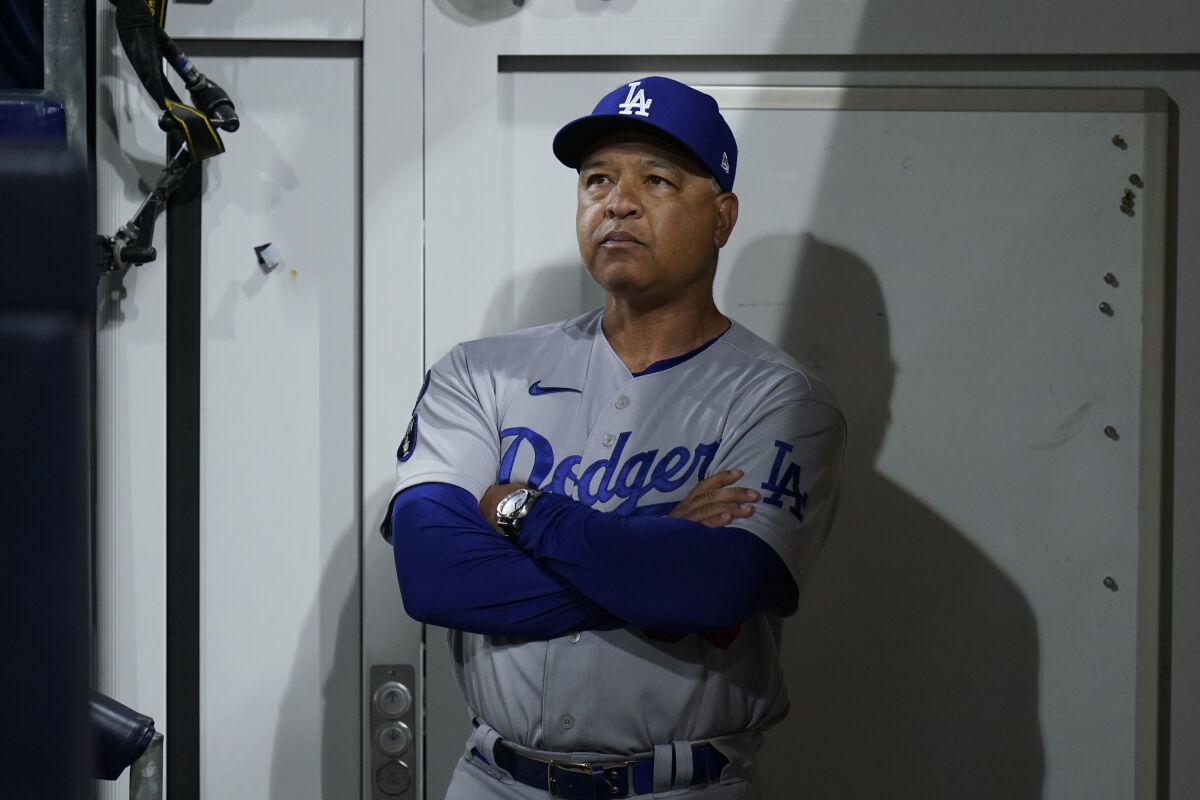 Dodgers manager Dave Roberts looks on before Game 4 of the NLDS on Saturday.