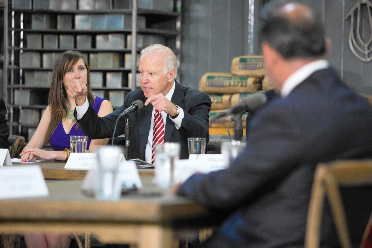 Vice President Joe Biden, center, addresses a roundtable discussion in Lincoln Heights on Tuesday; earlier, Biden praised Mayor Eric Garcetti's plan to raise the minimum wage.
