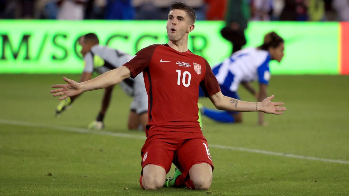 Christian Pulisic celebrates after scoring a goal against Honduras during their World Cup qualifier on Friday night in San Jose. Pulisic also had two assists. (Ezra Shaw / Getty Images)