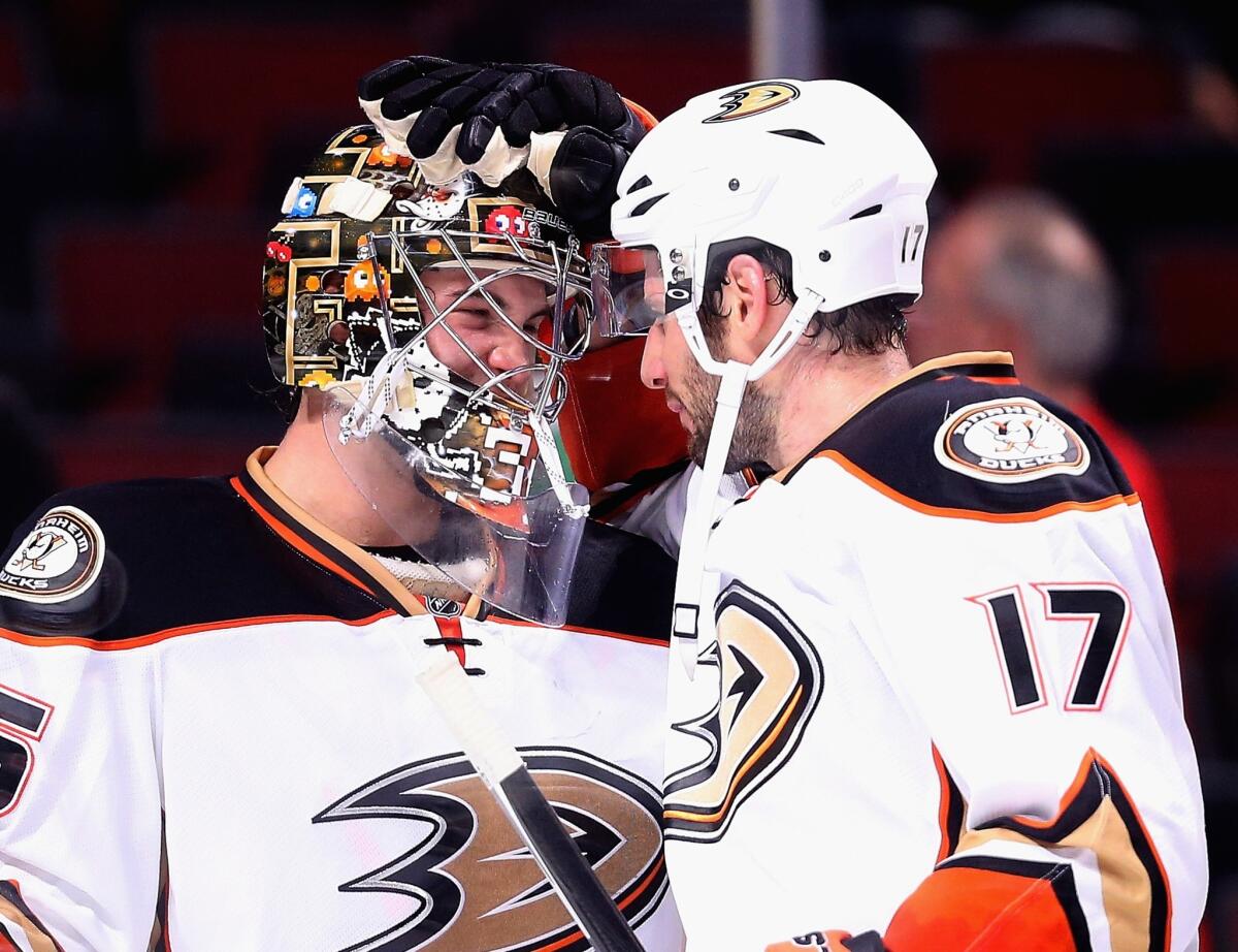 Ducks John Gibson and Ryan Kesler celebrate after a shutout win over the Chicago Blackhawks on Oct. 28.