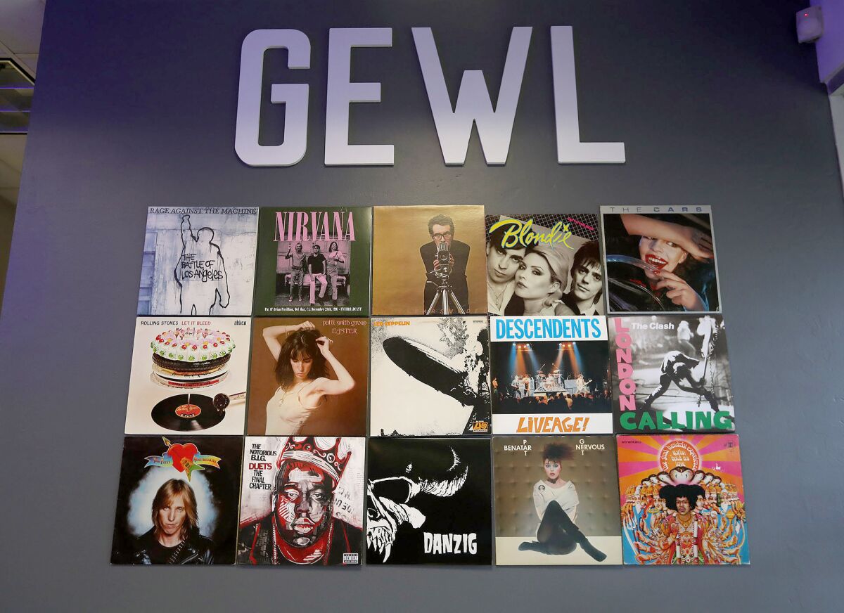 Popular music albums from different genres adorn the wall at the GEWL sandwich shop in Costa Mesa.