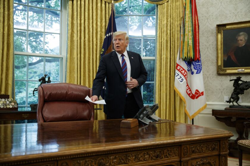 President Donald Trump arrives for a phone call with Mexican President Enrique Pena Nieto about a trade agreement between the United States and Mexico, in the Oval Office of the White House, Monday, Aug. 27, 2018, in Washington. (AP Photo/Evan Vucci)