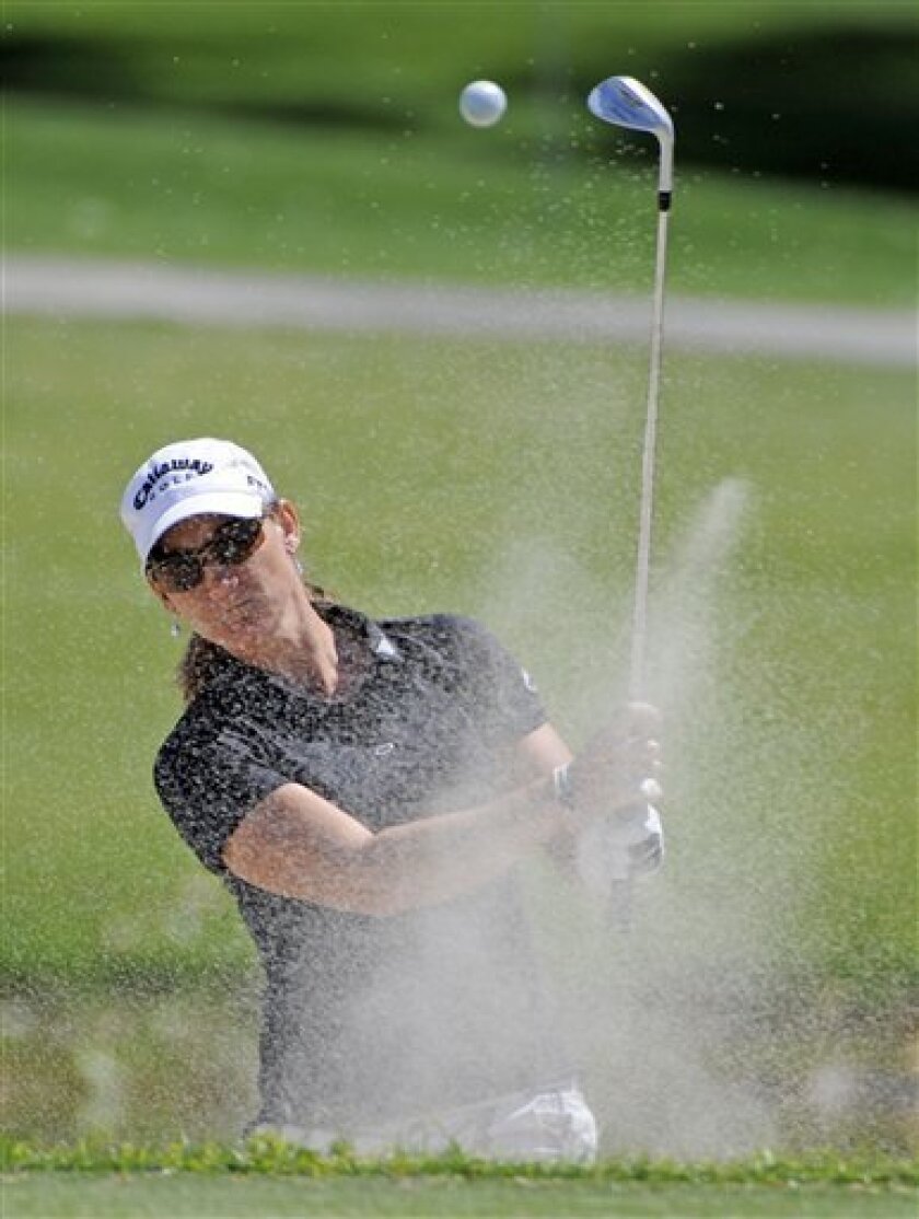 Kristy McPherson watches her bunker shot on the fifth hole during the third round of the LPGA Kraft Nabisco Championship golf tournament in Rancho Mirage, Calif., Saturday, April 4, 2009. (AP Photo/Chris Carlson)