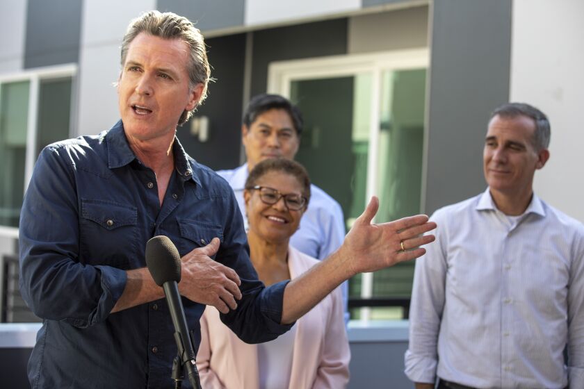 Los Angeles, CA - August 24 Gov. Gavin Newsom speaks a Homekey site to announce the latest round of awards for homeless housing projects across the state on Wednesday, Aug. 24, 2022 in Los Angeles, CA. (Brian van der Brug / Los Angeles Times)