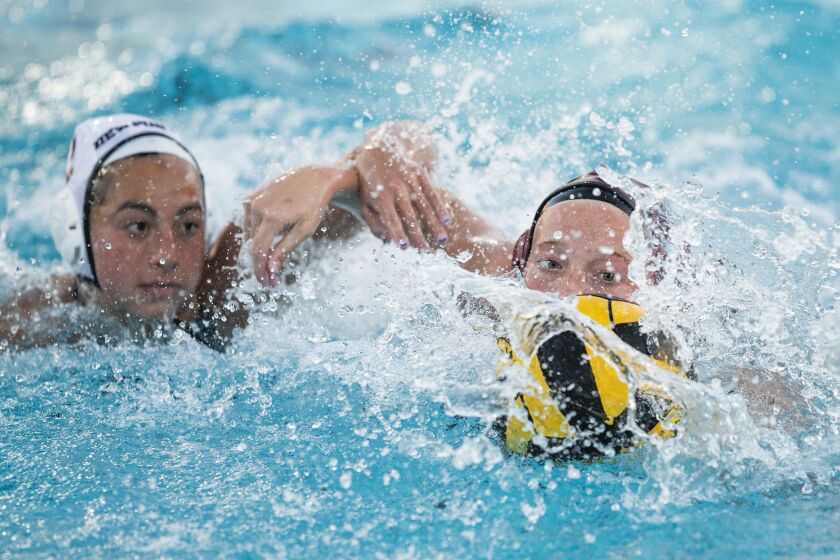 Los Alamitos, CA- January 24: Laguna Beach's Ava Knepper and Newport Harbor's Sophia Del Villar battle for a ball during a Surf League match on Tuesday, Jan. 24, 2023 in Los Alamitos, CA. (Scott Smeltzer / Daily Pilot)