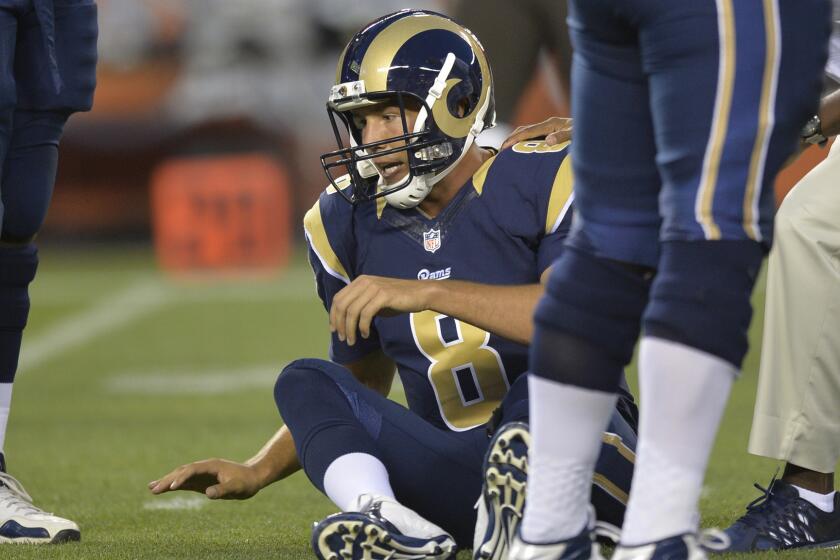 St. Louis Rams quarterback Sam Bradford sits on the field after tearing his left ACL during a preseason game against the Cleveland Browns on Saturday.