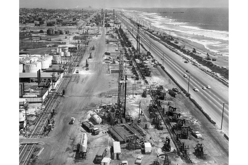 Aug. 2, 1966: Signal Oil production rigs line Pacific Coast Highway for about a mile between Huntington Beach and Seal Beach.