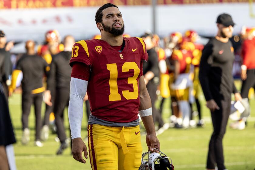 LOS ANGELES, CA - NOVEMBER 18, 2023: USC Trojans quarterback Caleb Williams (13) paces the sidelines during the fourth quarter of the team's 38-20 loss to UCLA at the LA Memorial Coliseum on November 18, 2023 in Los Angeles, California.(Gina Ferazzi / Los Angeles Times)
