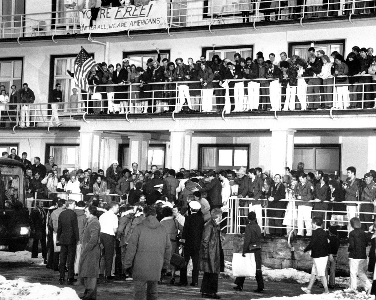 Some of the 52 U.S. citizens held hostage are cheered by the crowd at Wiesbaden U.S. Air Force hospital on Jan. 21, 1981.