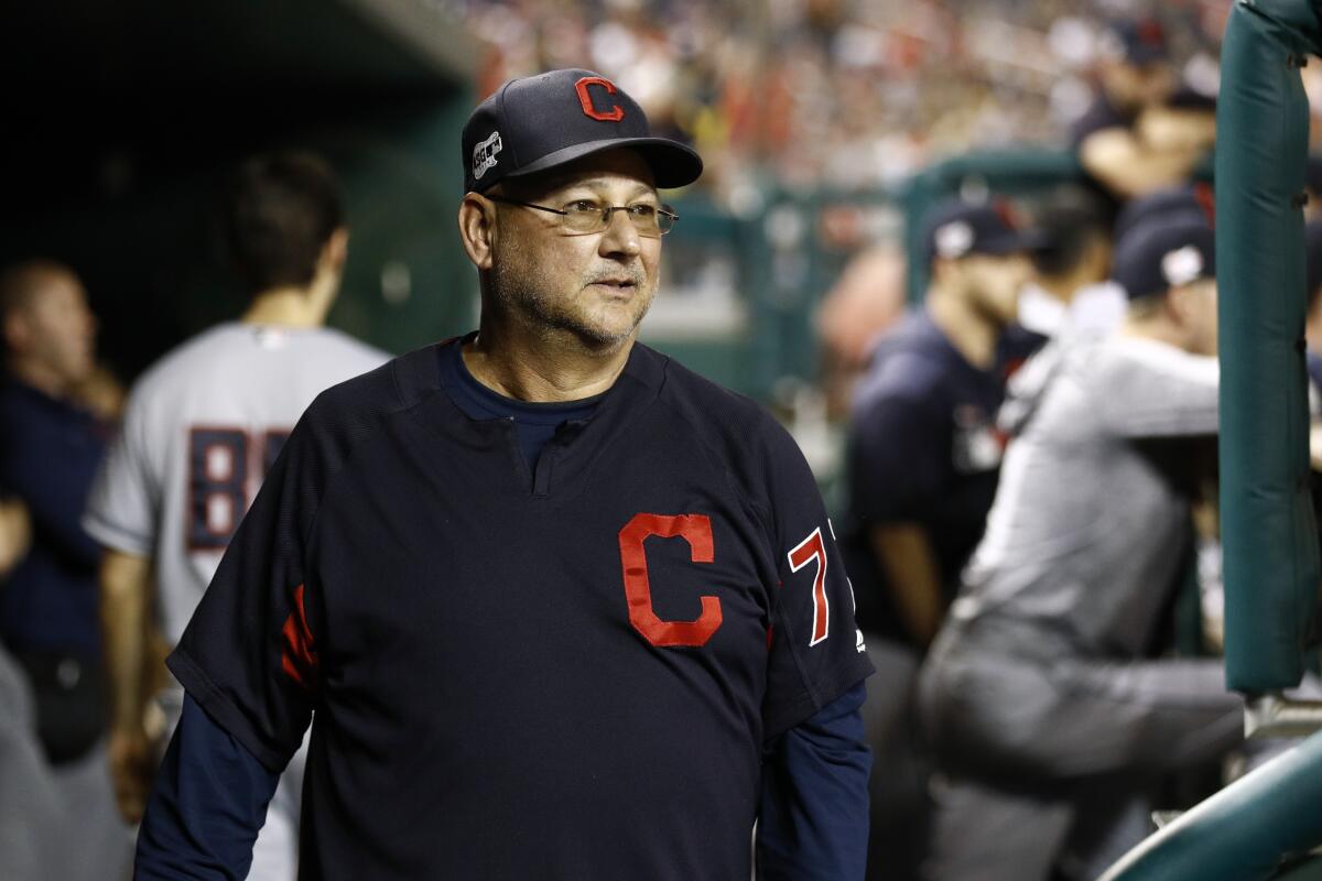 Cleveland Indians manager Terry Francona walks in the dugout during a game.